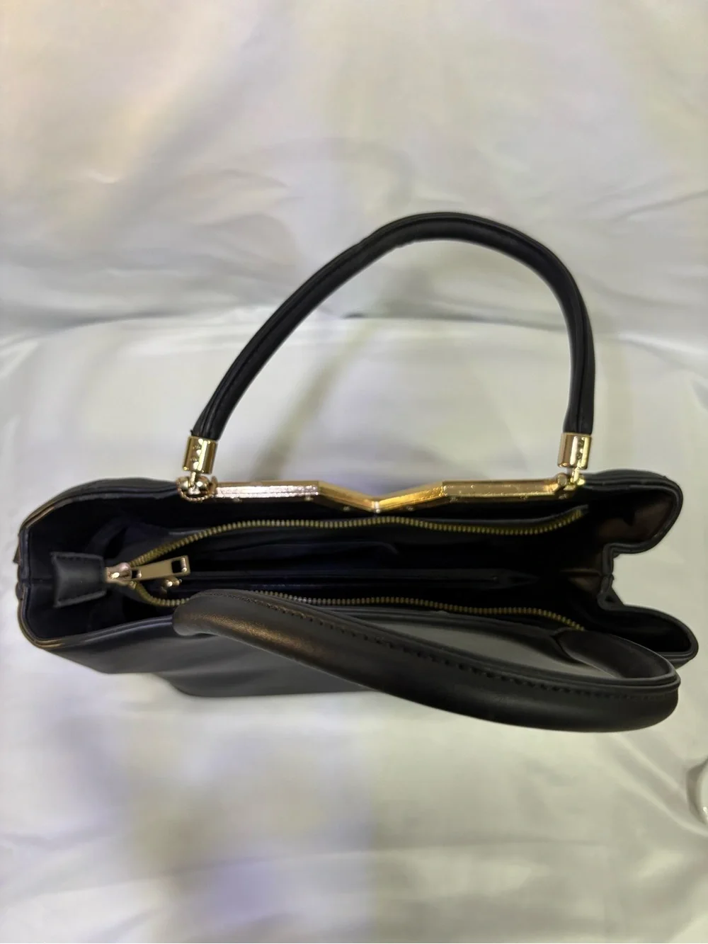 Quilted Black Tote with Gold V Accent and Tassel Charm